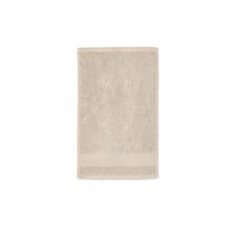 A light beige cotton towel with a textured surface, featuring a plain border. It has a brand logo at one end.