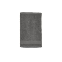 A grey cotton towel featuring a textured surface and a flat woven band at one end. It has a logo branding.