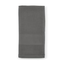 A folded grey towel with a textured pattern, featuring a branding logo. Made in Portugal.