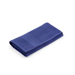 A folded towel in a deep blue hue, featuring a textured design. It has a logo on one side.