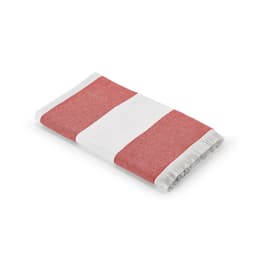 A folded towel featuring bold red and white stripes with fringed edges. It has a branding logo.