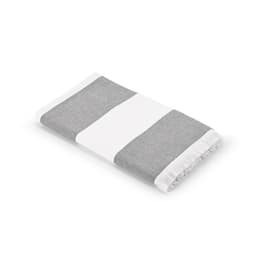 A cotton towel with grey and white stripes, featuring fringed edges. Made in Portugal.