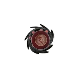 A spiral design featuring a central circular element in brown, surrounded by black and red abstract components.