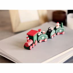 A festive wooden toy train in red and green, featuring holiday-themed decorations and characters.