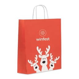 A red gift bag featuring three reindeer illustrations and a logo at the top. It has white handles.