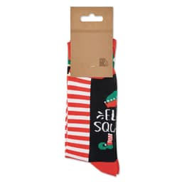 A pair of festive socks featuring a mix of red, green, and black colours with a logo on the packaging.