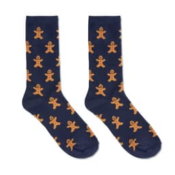 A pair of navy socks featuring a repeating gingerbread man pattern in orange. The socks have a playful design and a logo.