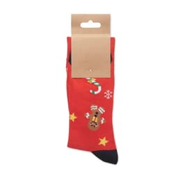 A pair of red socks featuring Christmas designs, including gingerbread men, candy canes, and snowflakes, with packaging attached.