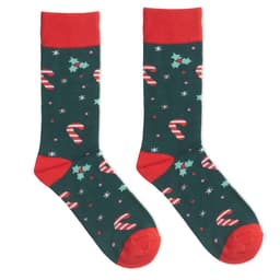 A pair of festive socks featuring a green background with candy canes, holly, and snowflakes, accented with red cuffs and toes.