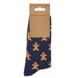 A pair of navy socks featuring gingerbread man patterns, packaged with a simple brown hang tag.