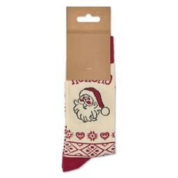 A Christmas sock in cream with red details and a Santa design, packaged with a brown tag.