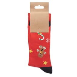 A pair of red socks featuring festive designs like candy canes and snowflakes, packaged with a cardboard hanger.