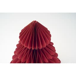 A decorative red paper sculpture resembling a tree, featuring layered, scalloped edges. It has a plain white background.