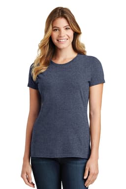 A woman wearing a navy blue short-sleeve t-shirt, standing and smiling. The shirt has a logo.