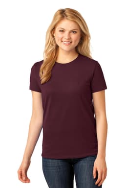 A woman models a burgundy t-shirt with short sleeves, featuring a logo on the upper left side.