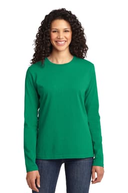 A woman wearing a green long sleeve cotton t-shirt with a round neckline, paired with jeans. The shirt features a logo.