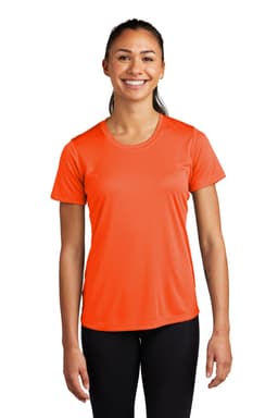 A woman is wearing an orange short-sleeved athletic t-shirt with a logo on the chest.