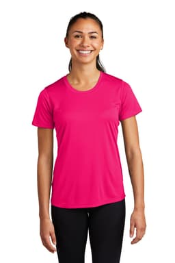 A bright pink Sport-Tek Ladies PosiCharge Competitor Tee displayed on a model wearing black leggings. The shirt includes a logo.