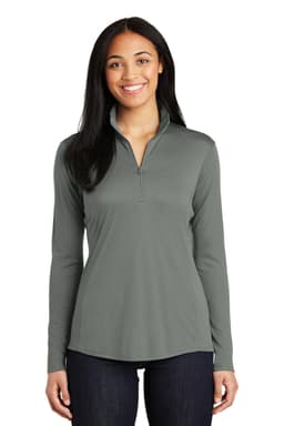 A woman models a grey Sport-Tek Ladies PosiCharge Competitor 1/4-Zip Pullover with a zipper and long sleeves.