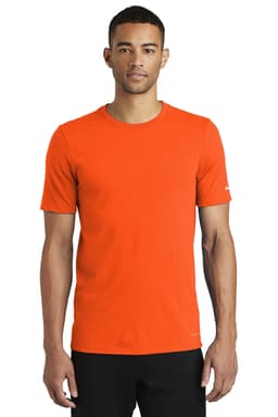 An orange Nike Dri-FIT cotton/polyester T-shirt on a male model. The shirt has a logo and short sleeves.