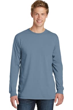A man wears a long sleeve tee in a soft blue colour, featuring a logo on the front.
