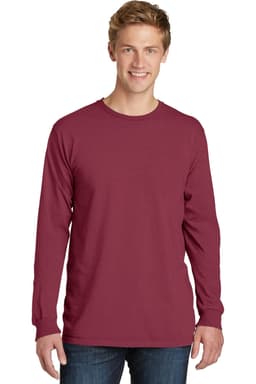 A long sleeve tee in a burgundy shade, featuring a logo, worn by a smiling model.