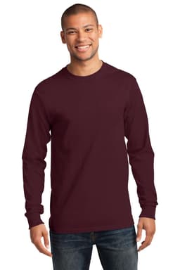 A man wearing a burgundy long sleeve essential tee, featuring a logo, paired with jeans.