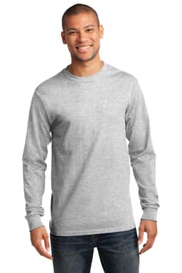 A grey long sleeve essential tee on a smiling model, featuring a logo on the shirt.