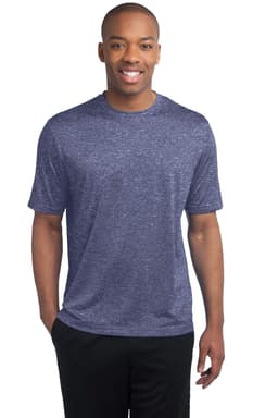 A man wearing a blue heather Sport-Tek Heather Contender Tee, standing and smiling against a white background.