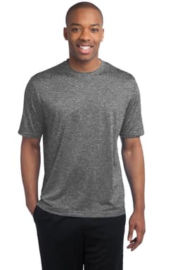 A man wearing a grey heathered T-shirt, smiling and standing with his hands at his sides. The shirt has a logo.