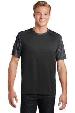 A man wears a Sport-Tek CamoHex Colorblock Tee in black, featuring a camo-patterned design on the shoulders.