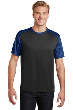 A man wearing a Sport-Tek CamoHex Colorblock Tee in black and blue, featuring a logo on the shirt.
