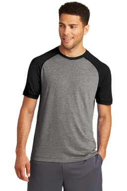 A grey T-shirt with black raglan sleeves, designed for a sporty appearance. It features a logo.