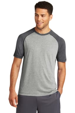 A grey and navy raglan tee featuring short sleeves and a logo. Suitable for sport or casual wear.