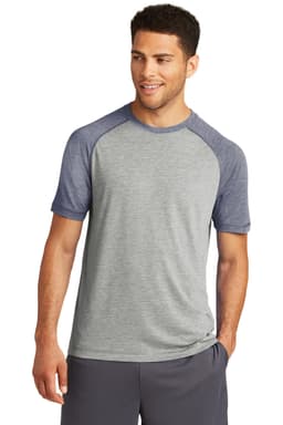 A grey and navy blue raglan t-shirt with short sleeves, featuring a logo on the front.