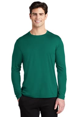 A man wearing a green long sleeve tee with a fitted design. The shirt features a logo on the chest.