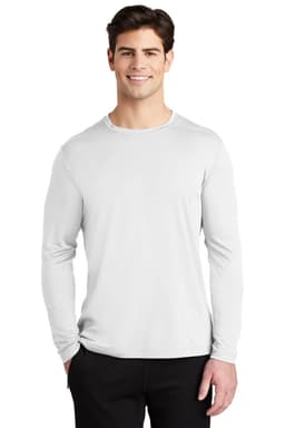 A long sleeve tee in white, featuring a crew neck and a logo on the sleeve. Model is standing with hands in pockets.