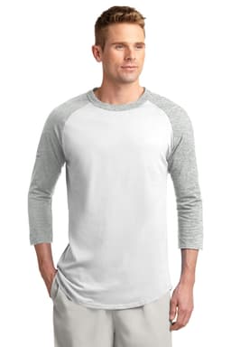 A man is wearing a Sport-Tek Colorblock Raglan Jersey, featuring white and grey colours with three-quarter sleeves.