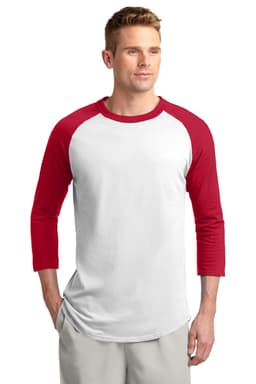 A man wearing a Sport-Tek Colorblock Raglan Jersey in white with red sleeves and a logo on the front.