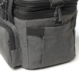 A grey cooler bag with multiple zippered compartments and pockets, featuring a logo on the side.