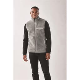 Men's Bergen Sherpa fleece vest in light grey, featuring a zip-up front and a chest pocket. Black long-sleeve shirt underneath.