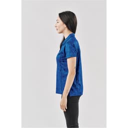 A blue women's polo shirt with a fitted design, featuring a collar and short sleeves. It has a logo on it.