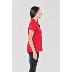 A red Women's Galapagos Polo shirt displayed on a model, viewed from the side. The shirt features a collar and has a logo.