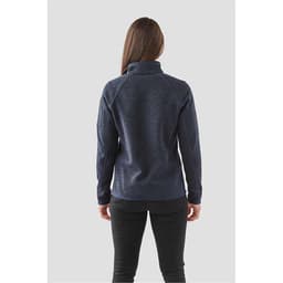 A navy women's 1/4 zip pullover with a high collar and a fitted design, featuring a logo on the sleeve.