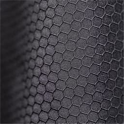 A close-up of textured black fabric with a hexagonal pattern, featuring a subtle sheen.