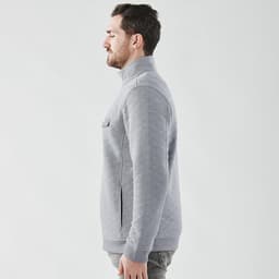 A grey thermal 1/4 zip pullover for men, featuring a standing collar and side pockets.