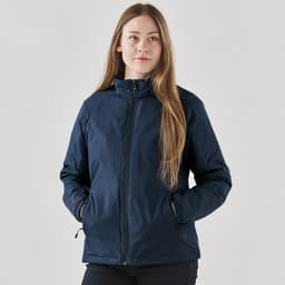 A women's thermal jacket in navy blue, featuring a zip front and side pockets, with a logo on the sleeve.