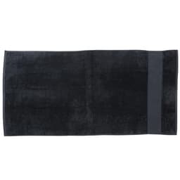 A dark black beach towel featuring a simple design, ideal for leisure and outdoor use. It has a logo on one side.