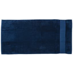 A deep navy blue beach towel featuring a smooth texture and a solid colour design, with a branded logo.