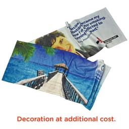 A sublimate sports towel featuring vibrant beach scenery and a person’s image, predominantly in blue and white.